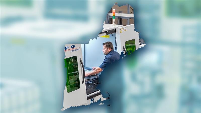 Outlined shape of New England with a person working with materials